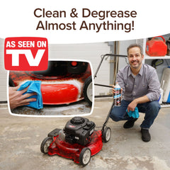 Person cleaning a red lawn mower with text 'Clean & Degrease Almost Anything! As Seen on TV'.